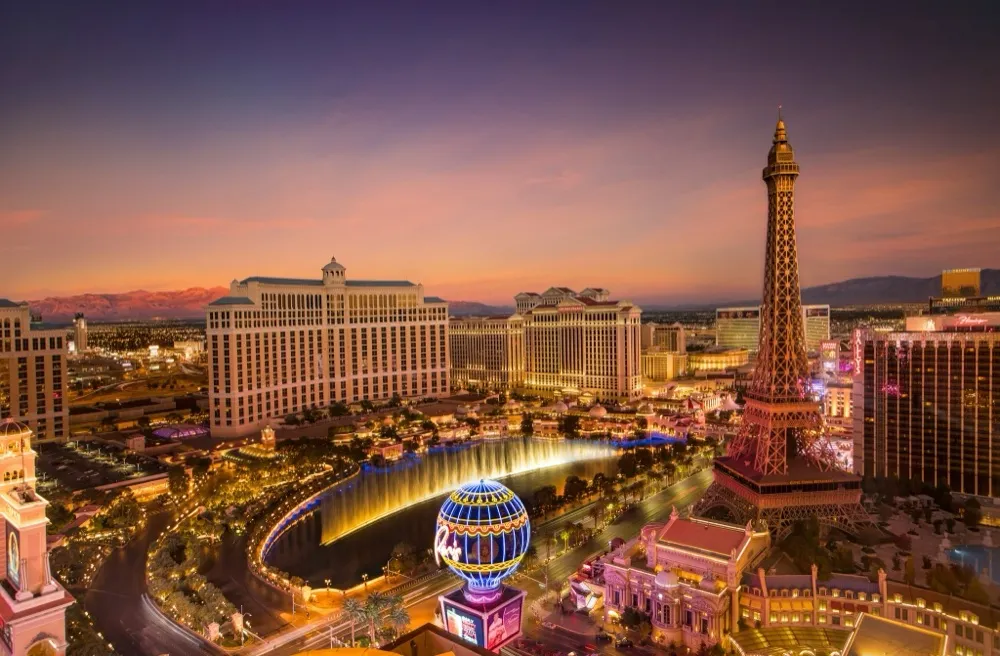 The Las Vegas Strip at dusk with the Bellagio fountains